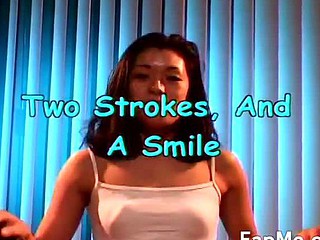 Sexy Oriental chick strokes two large dongs